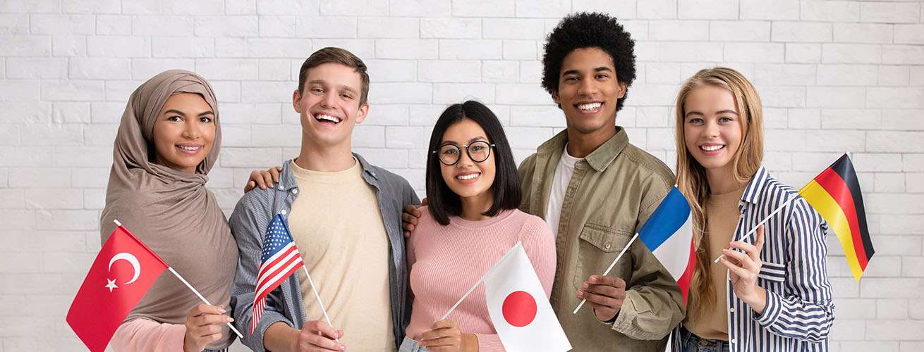 Multiethnic young students with flags of different countries