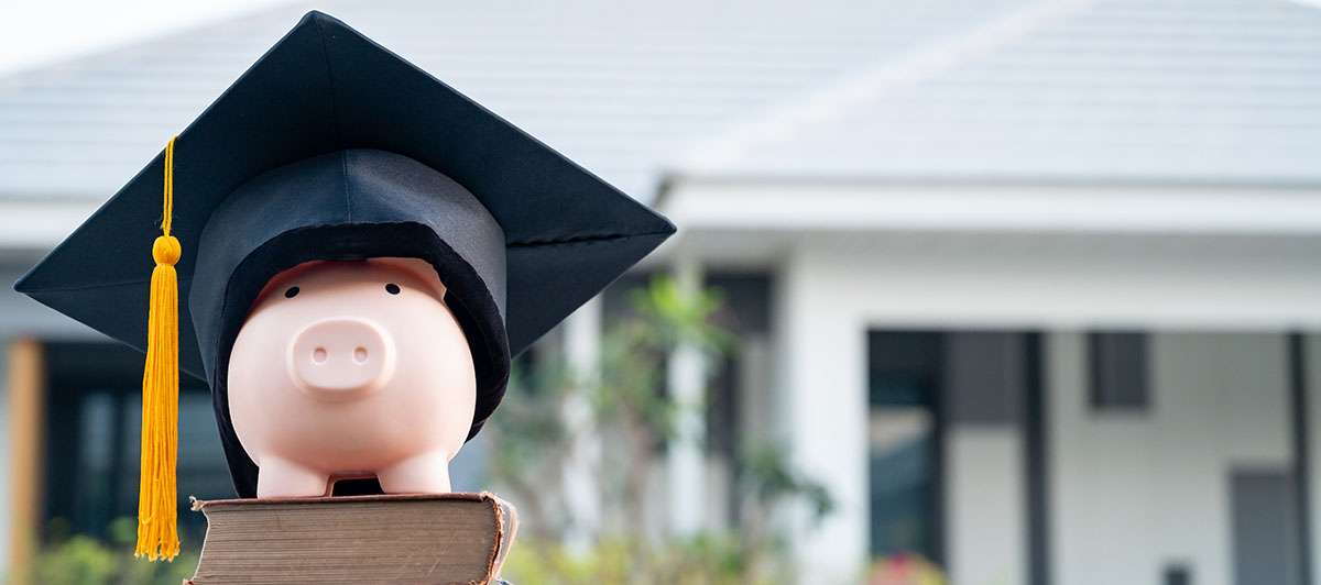 piggybank with a graduation cap