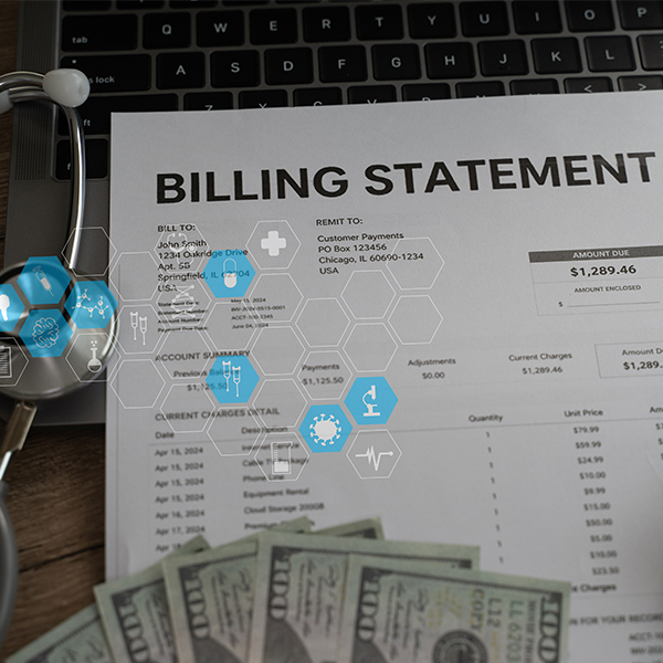 A medical billing statement on a table next to a stethoscope